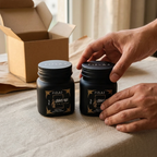 Customer-style unboxing photo of two FIZLAJ Oud Zaffron 140gm bakhoor containers in the duo bundle.